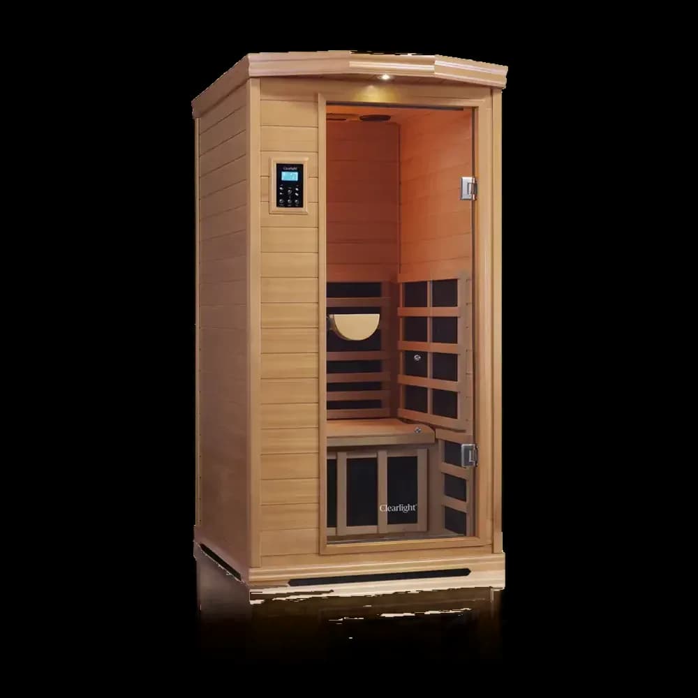 Clearlight Premier compact infrared sauna in warm reddish wood, glass door showing dark heater panels and a wood headrest inside