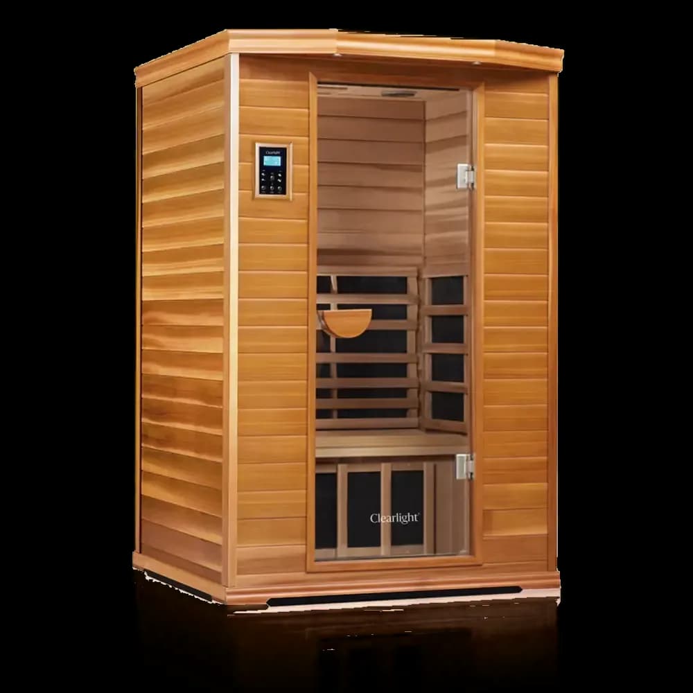 Clearlight Premier infrared sauna in rich reddish wood, glass door revealing slatted heater panels and a wood headrest