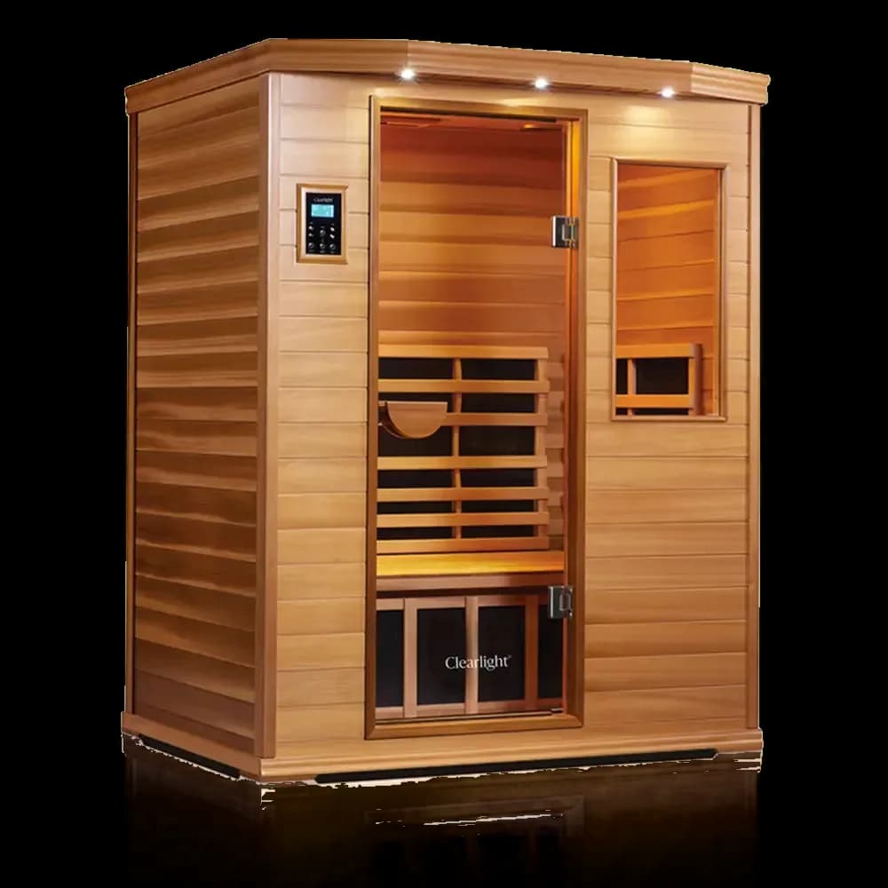 Clearlight Premier infrared sauna in reddish wood, glass door and side window beneath a lit roof cornice