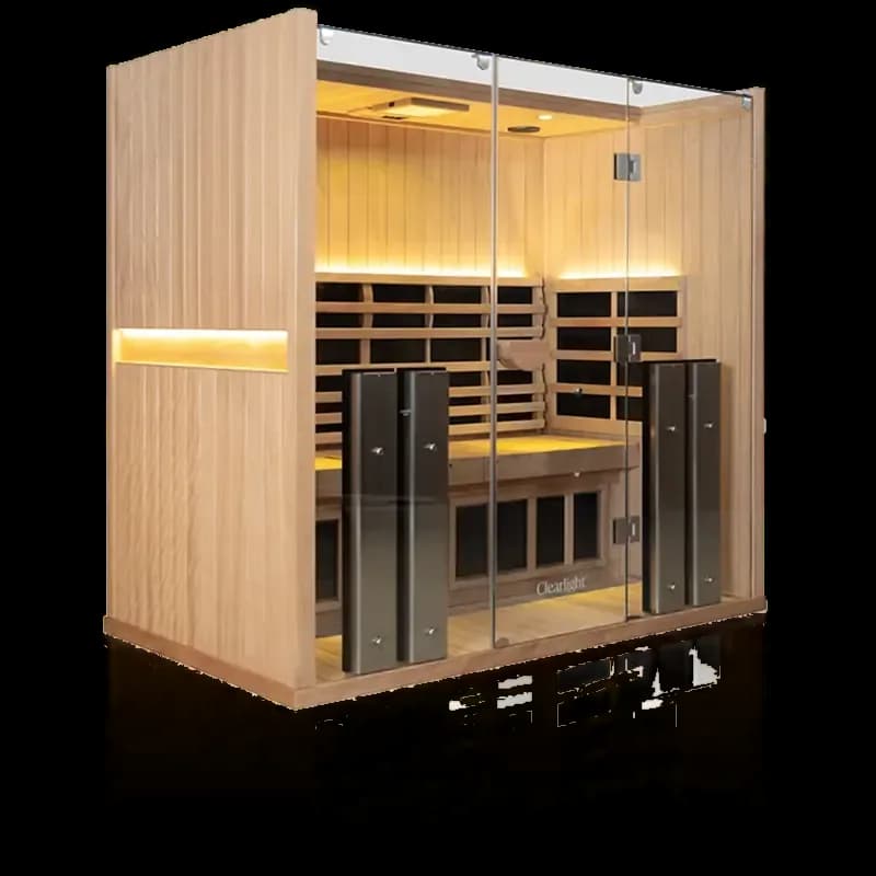 Clearlight Sanctuary 5 in pale golden wood, glass front, long bench and tall dark towers lit in warm light