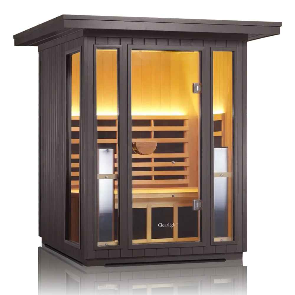 Clearlight Sanctuary Outdoor 2 with dark weatherproof cladding, glass front and a glowing mahogany interior