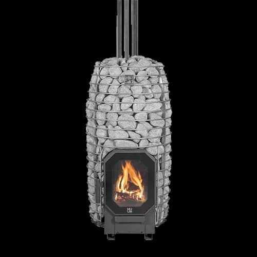 HUUM HIVE Flow Mini wood burning sauna stove on white, tall narrow stone cage full, flue pipe on top and a fire behind the glass door