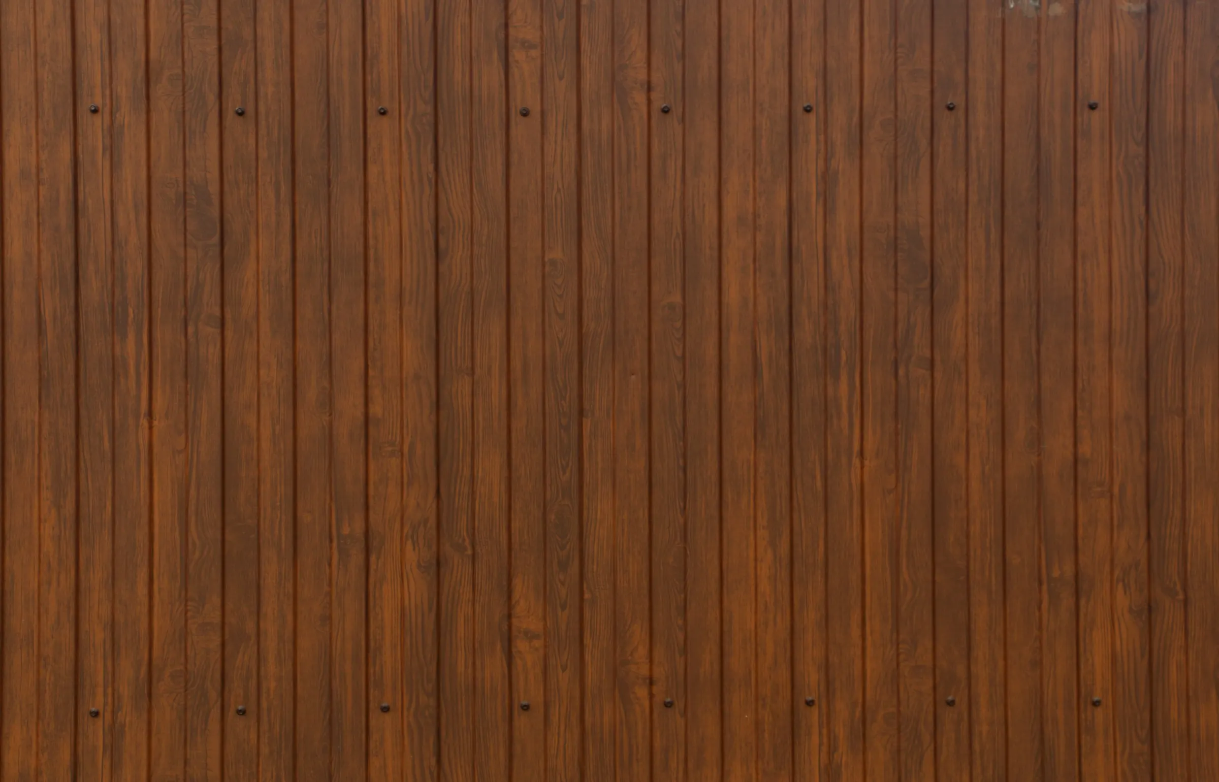 Vertical wooden boards with a warm brown finish.